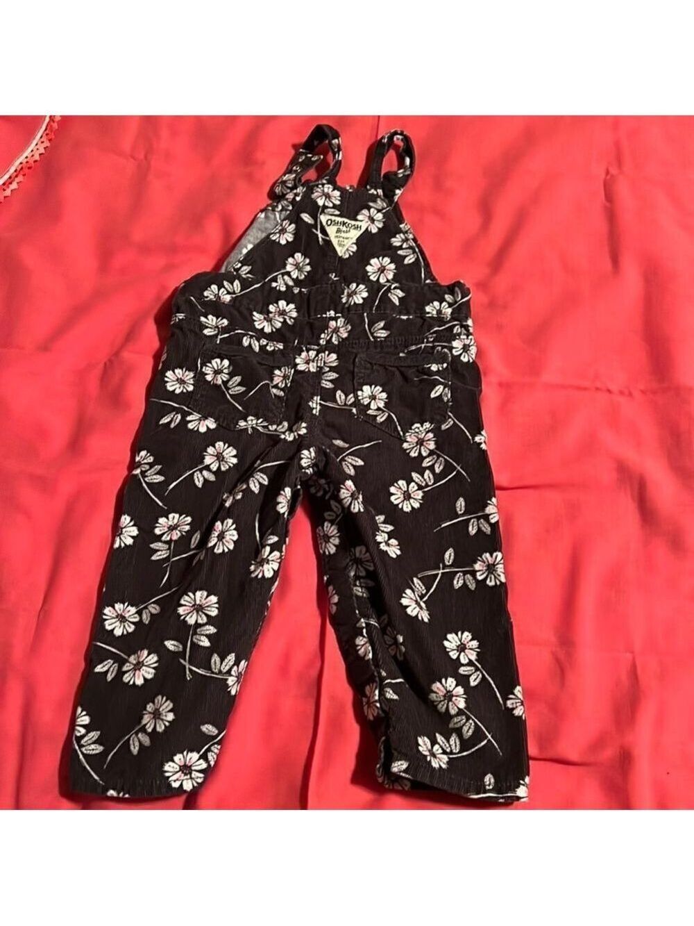 Osh Kosh girls black floral overalls. Size 12m